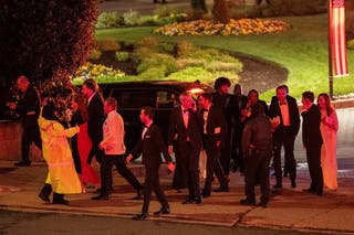 Attendees leave the venue as a shooter opens fire during the annual White House Correspondents' Association dinner in Washington, DC, US, 25 April 2026